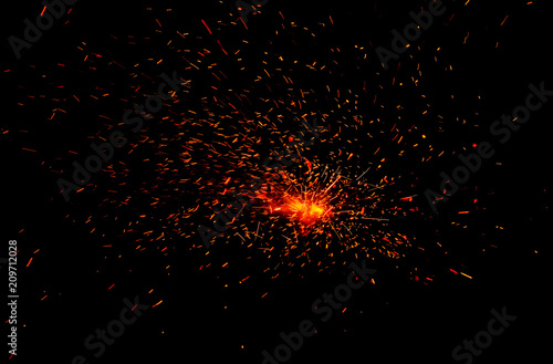 sparks from the fire on a black background