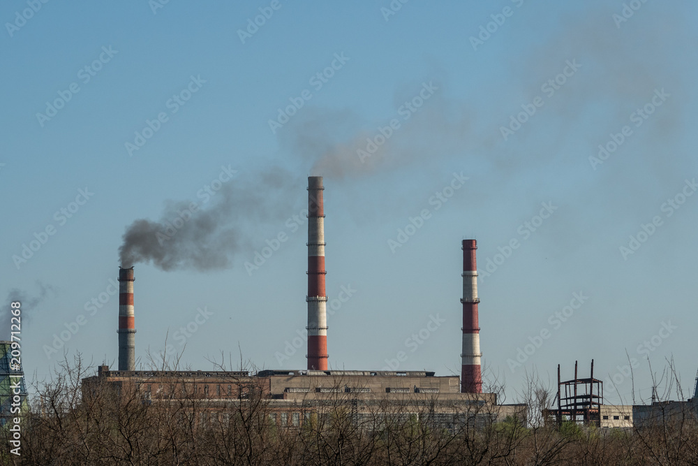 The plant emits smoke from the pipes, pollutants enter the atmosphere The plant emits smoke from the pipes, pollutants enter the atmosphere