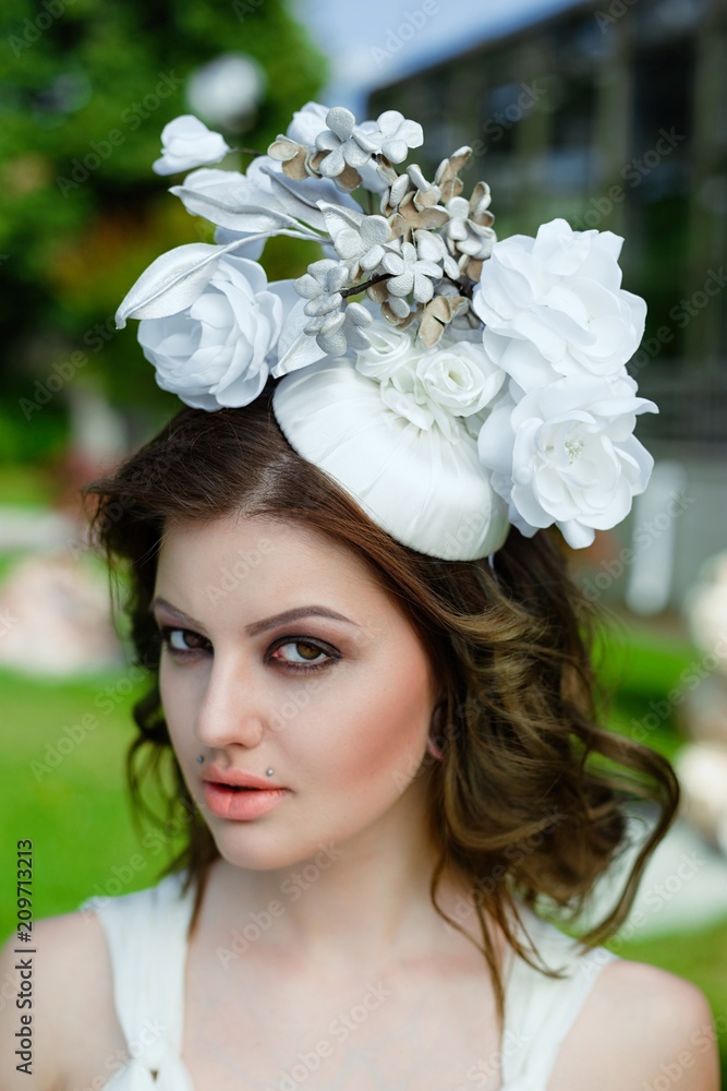 Obraz premium portrait of young sensual woman posing in elegant headwear