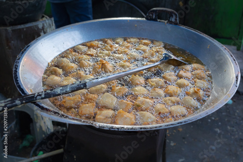 National street food of Indonesia - balls fried in boiling oil