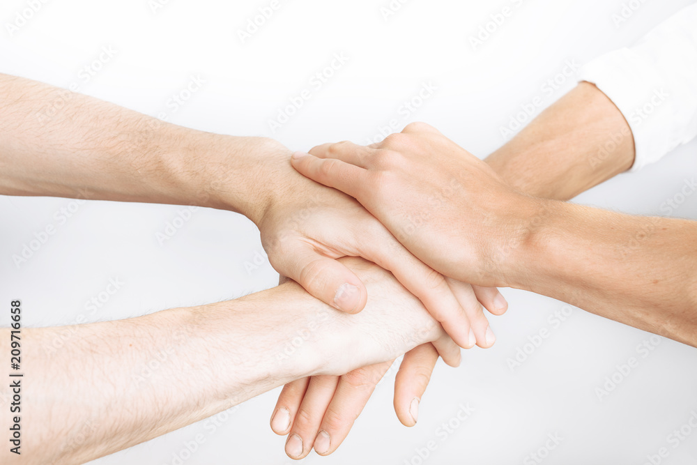 Friends praying together, as one team, success, victory, white background Friends praying together, as one team, success, victory, white background