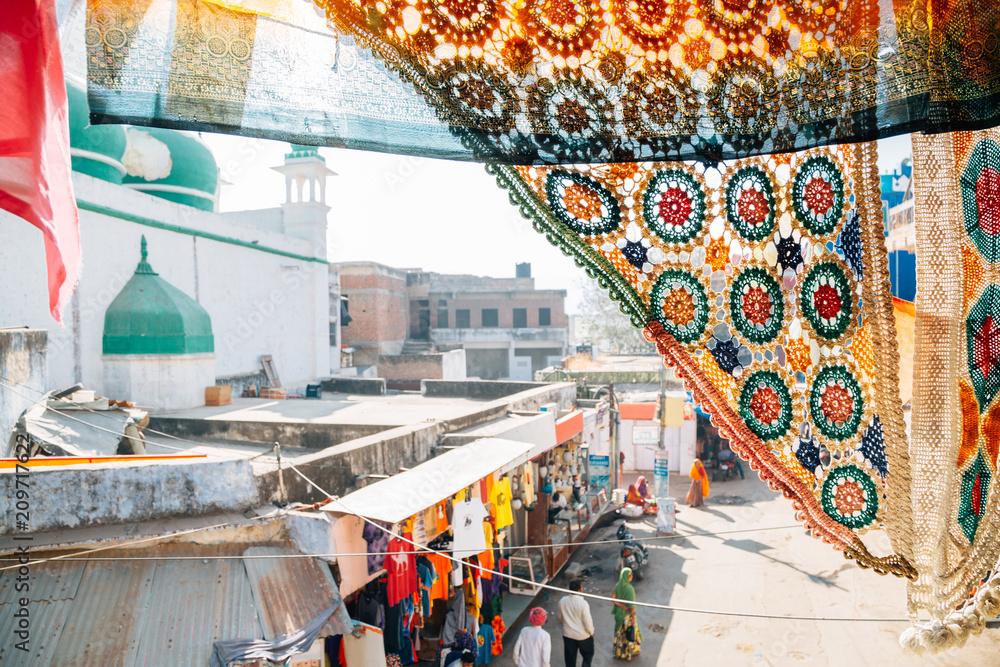 Pushkar old street market view over the curtain of the cafe