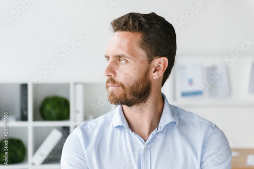 Close up of focused businessman standing