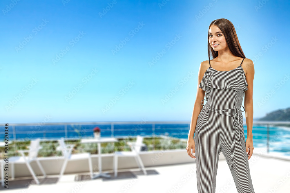 Slim young woman and summer resort restaurant with sea landscape. Free space for your text. 