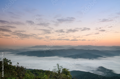 Sunset over mountains and fog