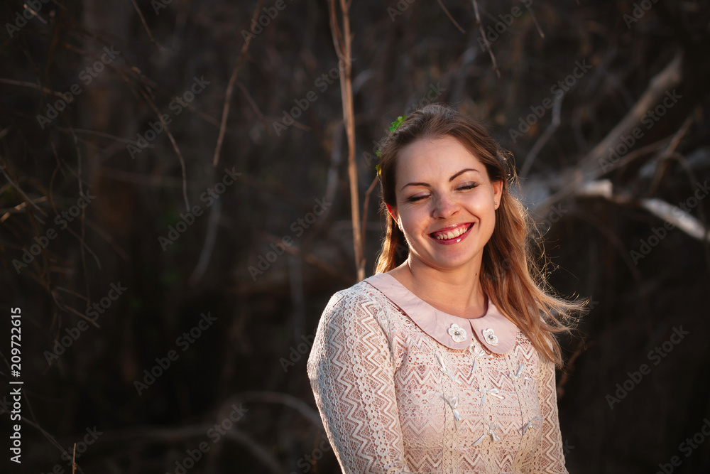 portrait of a girl in a field on a sunset background portrait of a girl in a field on a sunset background