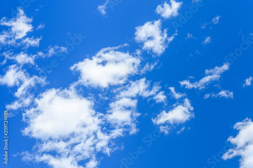 White fluffy clouds in a deep blue sky