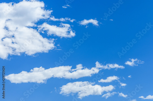 White fluffy clouds in a deep blue sky