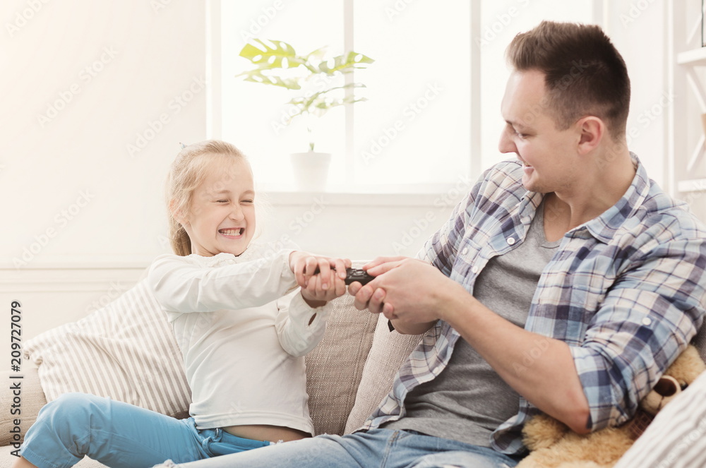 Daughter and father fighting for remote control Daughter and father fighting for remote control