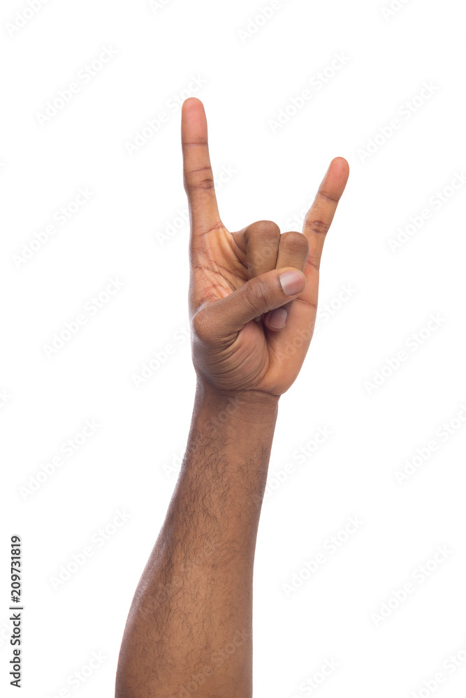 Male black hand making rock'n'roll gesture isolated on white Male black hand making rock'n'roll gesture isolated on white