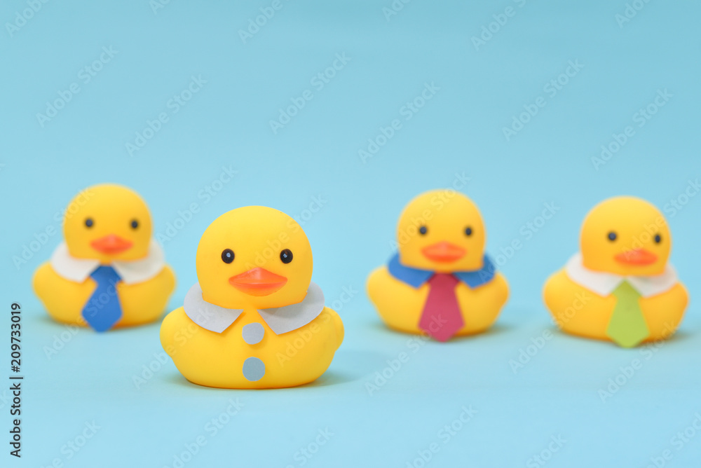 Leadership concept, one of rubber duck is standing out from the line. Leadership concept, one of rubber duck is standing out from the line.