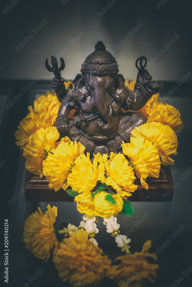 Colorful idol of Lord Ganesh with simple decoration of artificial flowers ;  worshiping for Ganapati..., Stock Photo, Picture And Rights Managed Image.  Pic. DPA-NMK-132451 | agefotostock