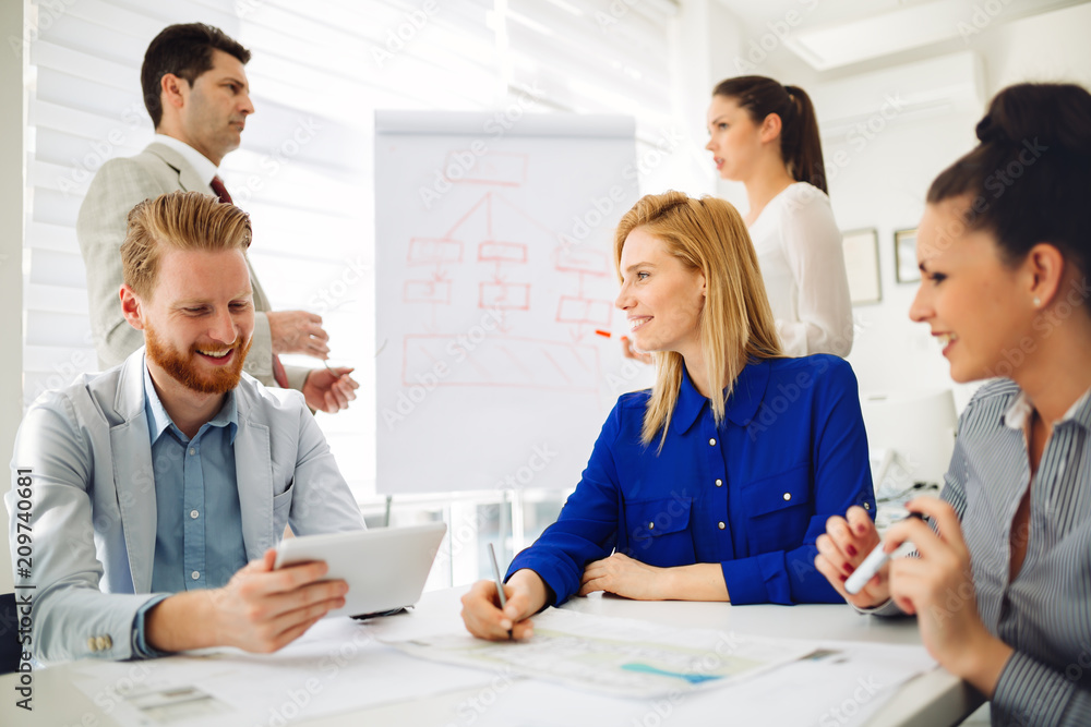 Businesspeople and architects planning Businesspeople and architects planning