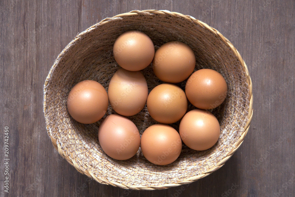 Topview egg in the basket on wood table. Topview egg in the basket on wood table.