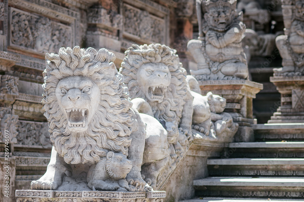 Traditional Balinese stone sculpture art and culture at Bali, Indonesia. Architecture, traveling and religion.