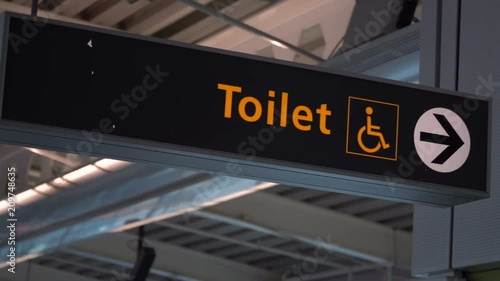 Public restroom signs with a disabled access symbol