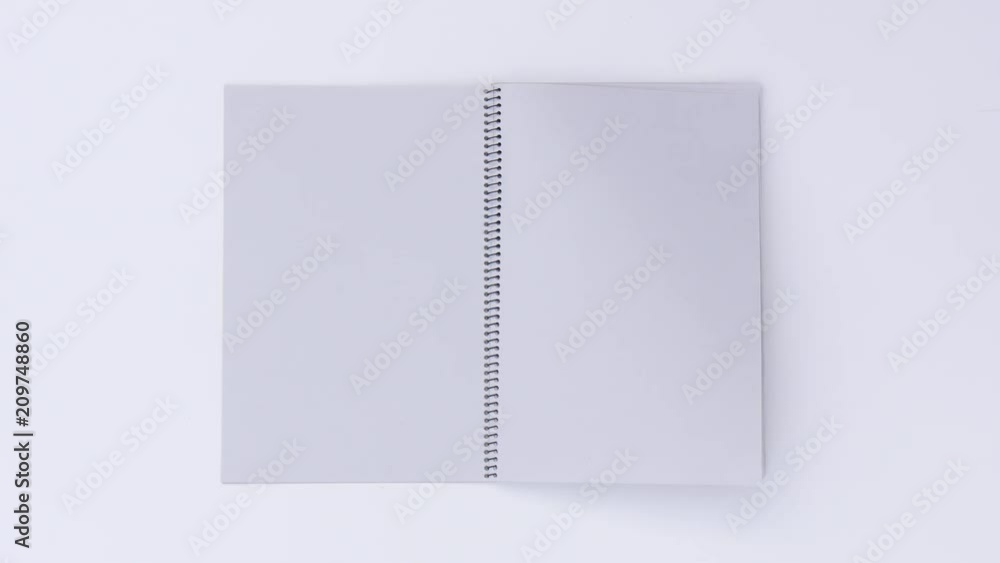 Turning page by the wind on a white background Turning page by the wind on a white background