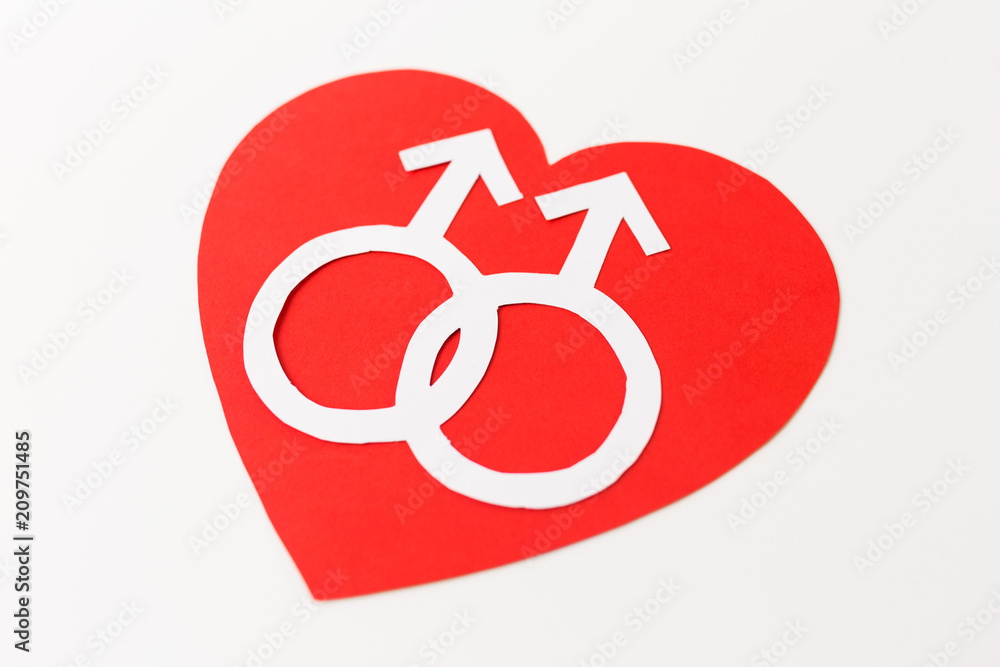 gay pride, homosexual, valentines day and lgbt concept - mars or male gender symbol on red heart over white background gay pride, homosexual, valentines day and lgbt concept - mars or male gender symbol on red heart over white background
