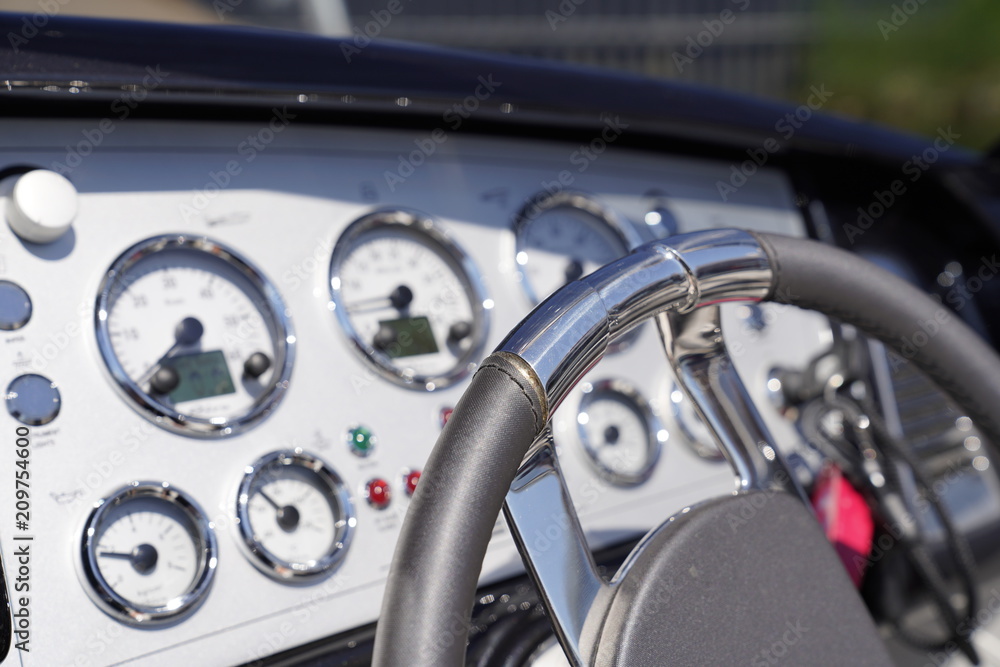 Steering wheel and a cockpit of a luxury motorboat Steering wheel and a cockpit of a luxury motorboat