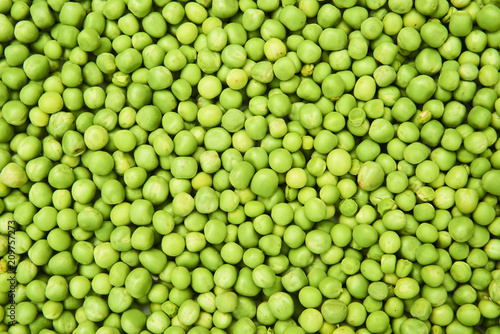 Fresh green peas background texture top view 