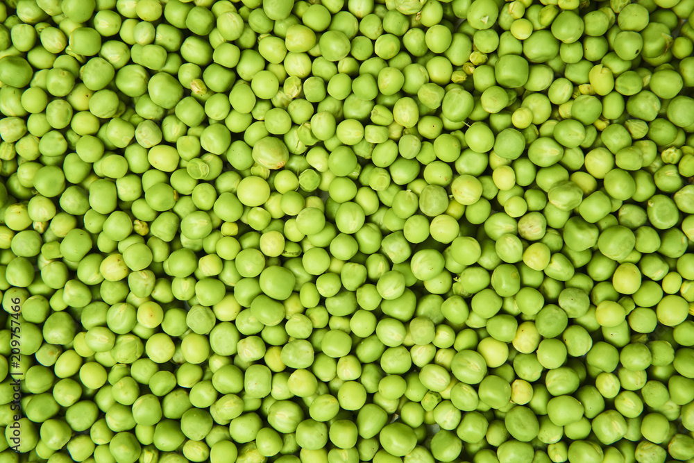 Fresh green peas background texture top view
