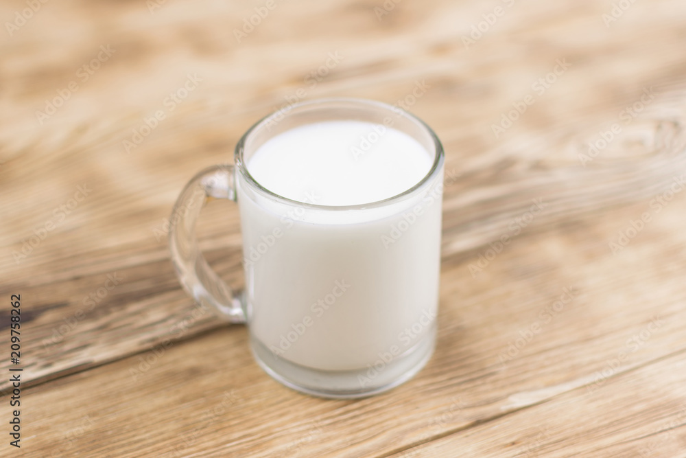 Glass kefir (milk) on a wooden background. The concept of diet, weight loss. Glass kefir (milk) on a wooden background. The concept of diet, weight loss.
