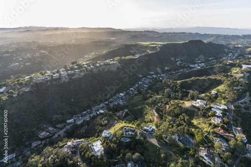 Aerial view of South Beverly Park canyon and hilltop homes in the Santa Monica Mountains above Beverly Hills and Los Angeles, California.  