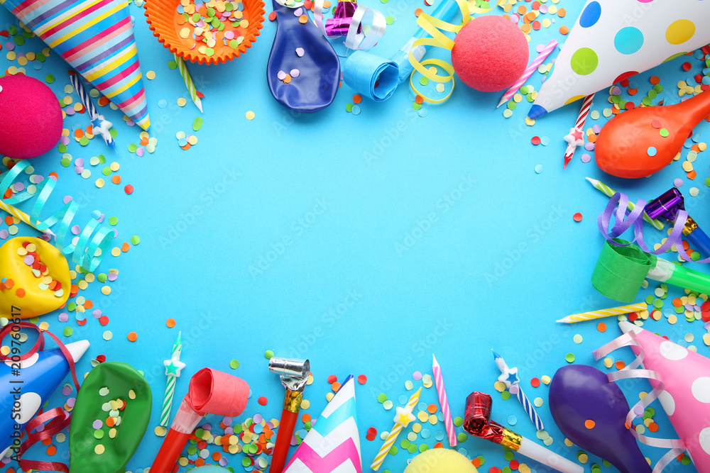 Birthday party caps, blowers and candles on blue background - obrazy, fototapety, plakaty 