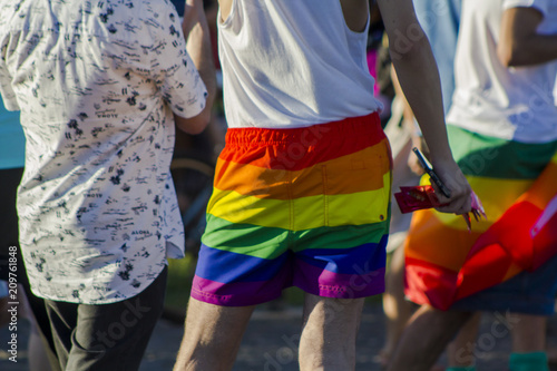 Man with rainbow shorts at an LGBT gay pride 