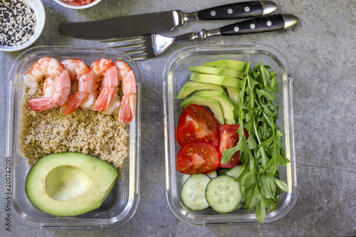 Healthy meal prep containers with quinoa and shrimp