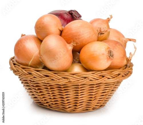 Onions in a basket isolated on white background