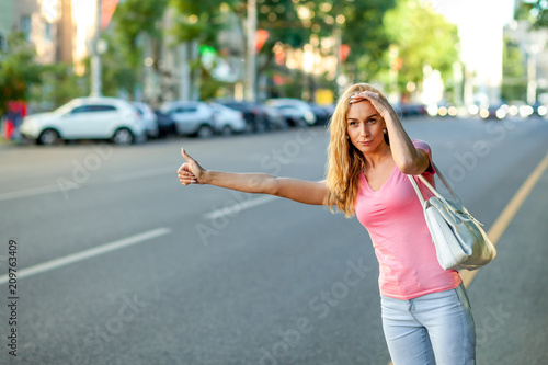 girl stops the car in the city