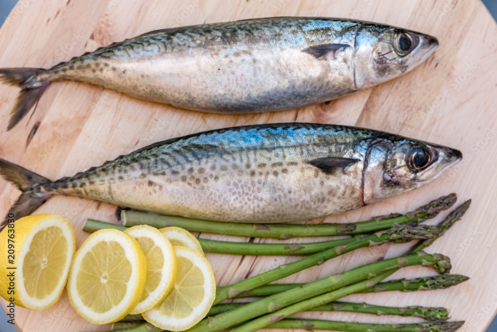 raw mackerel on wooden board