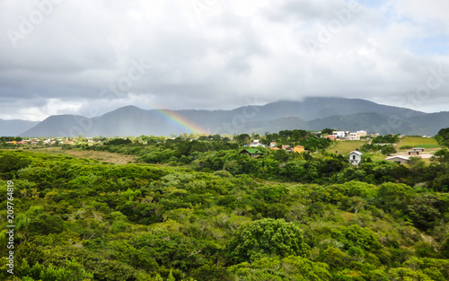 Rainbow over the Atlantic Forest in Florianopolis, Brazil photo