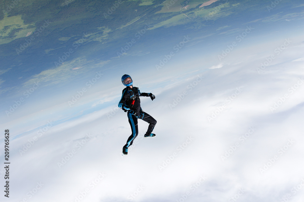 Freefly skydiving. Girl is falling is a headdown position. Freefly skydiving. Girl is falling is a headdown position.