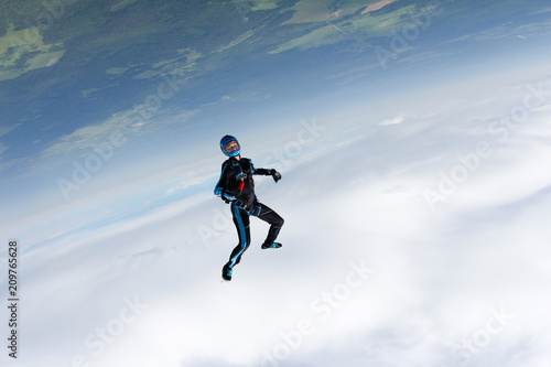 Freefly skydiving. Girl is falling is a headdown position.