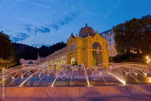 Main colonnade and singing fountain at night - center of Marianske Lazne (Marienbad) - great famous Bohemian spa town in the west part of the Czech Republic (region Karlovy Vary)