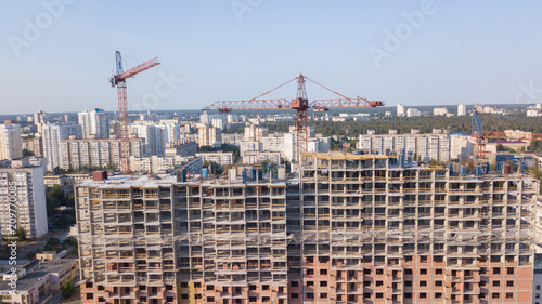 Aerial view on the building with construction cranes © savantermedia