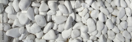 Foto White rounded pebble texture pattern.