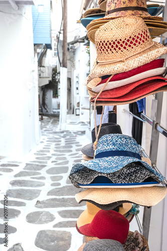 Straw summer hats on market stall outdoor