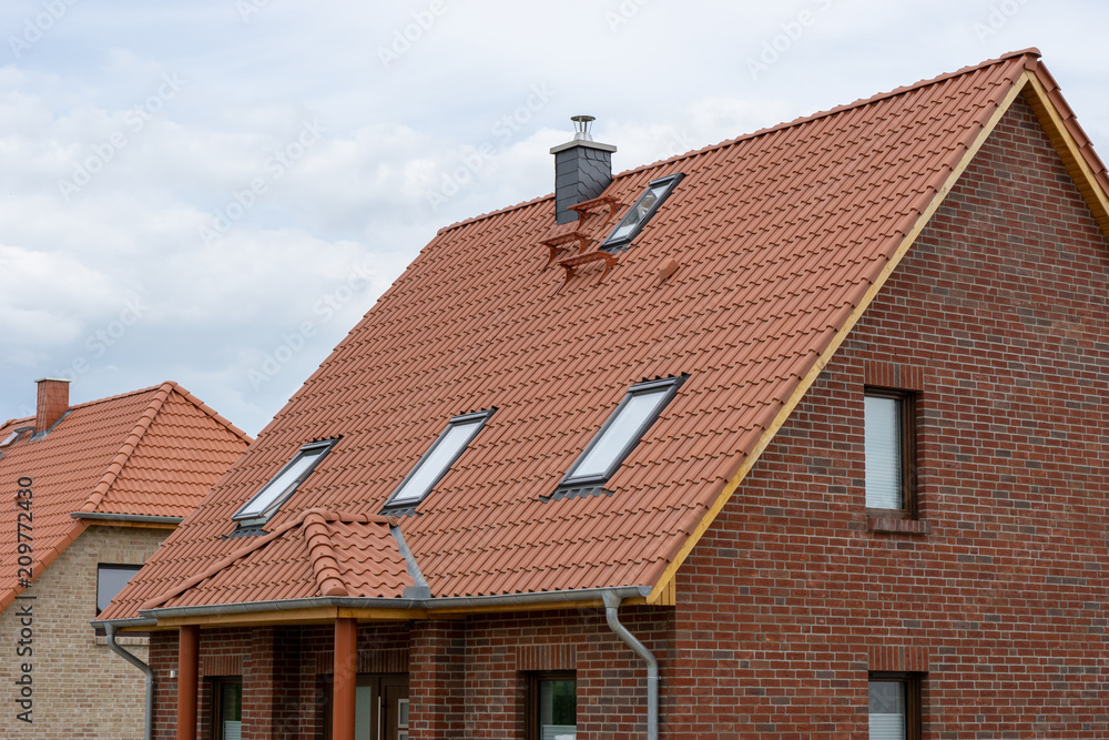 red tiled roof of a new house