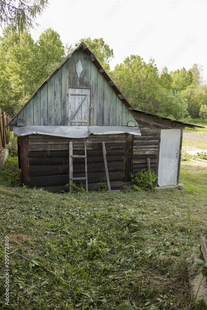 Old bathhouse in the village in the summer Old bathhouse in the village in the summer
