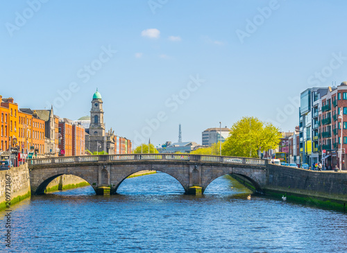 Riverside of Liffey dominated by Saint Paul's church in Dublin, Ireland