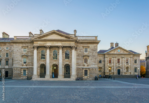 View of a building on the parliament square inside of the trinity college campus in Dublin, Ireland photo