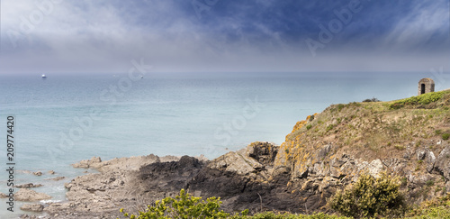 Ruins of a small medieval watchtower coastline near the Atlantic Ocean, Grandville, Brittany, France
