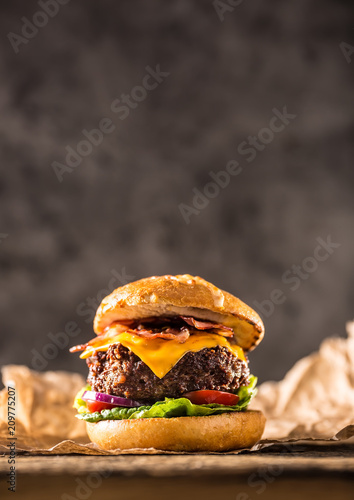 Close-up home made beef burger on wooden table