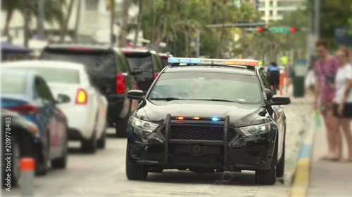Police car with flashing lights.