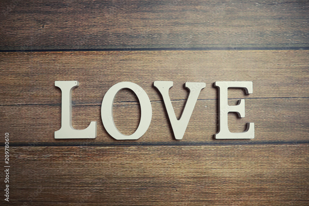 word Love from wooden letters on background word Love from wooden letters on background