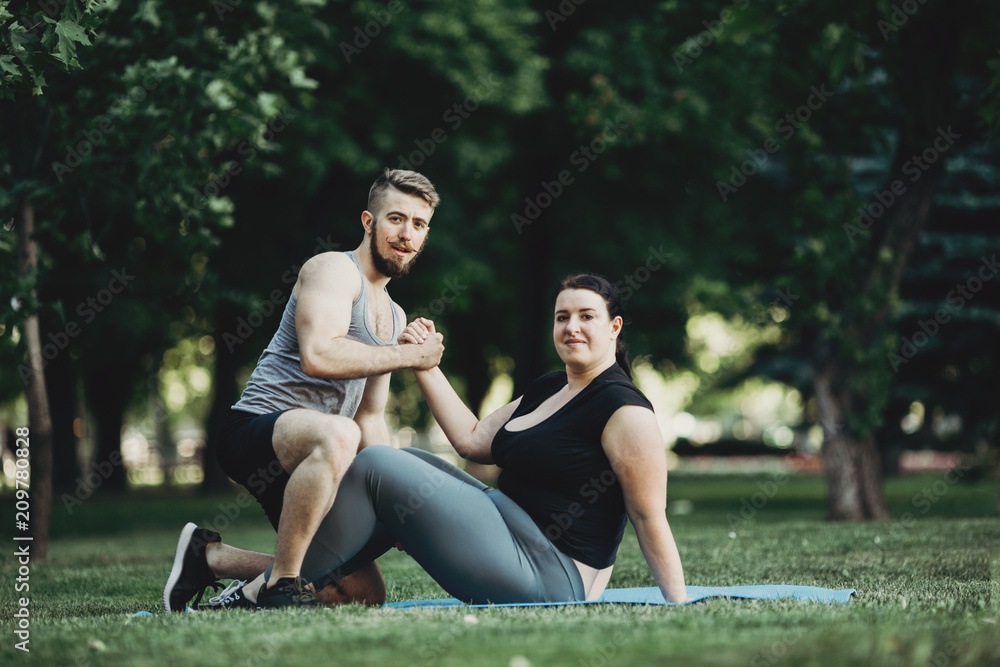 individual training. teamwork. success. personal yoga trainer. street workout. outdoor activity. Fitness instructor and client shaking hands individual training. teamwork. success. personal yoga trainer. street workout. outdoor activity. Fitness instructor and client shaking hands