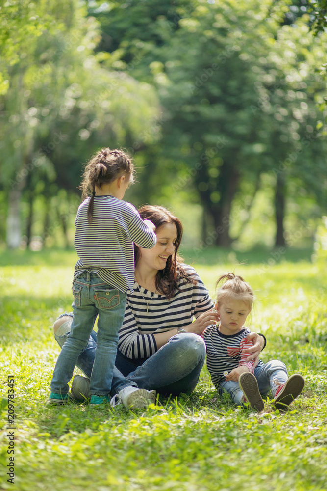 Mother and daughter having fun and playing together in the field. Mother and daughter having fun and playing together in the field.
